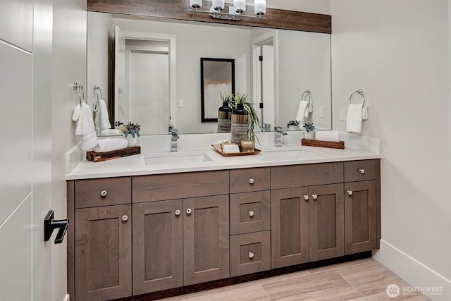 full bath with a sink and double vanity