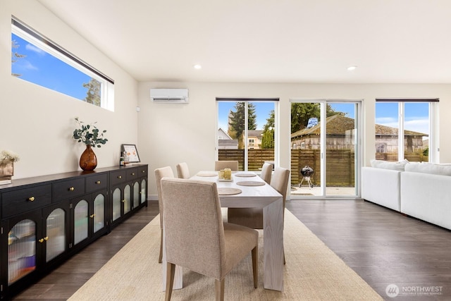 dining area with dark wood finished floors, recessed lighting, a wall mounted AC, and a wealth of natural light