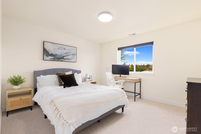 bedroom featuring visible vents, baseboards, and carpet