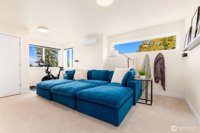 carpeted living area featuring an AC wall unit and baseboards