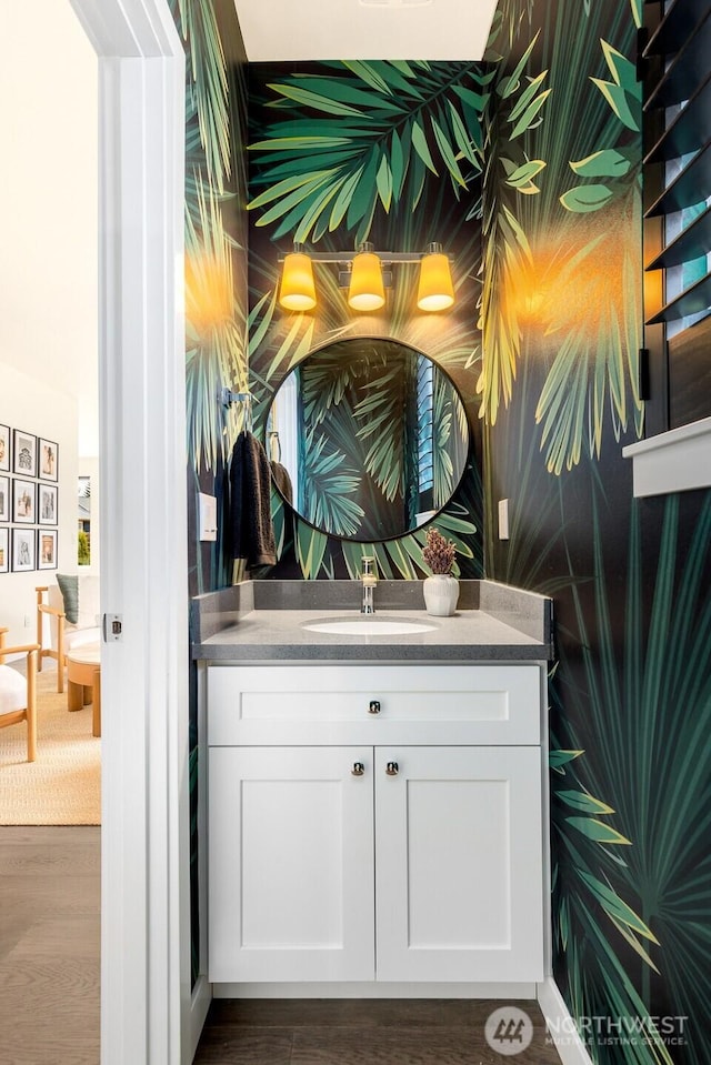 bathroom featuring vanity and wood finished floors