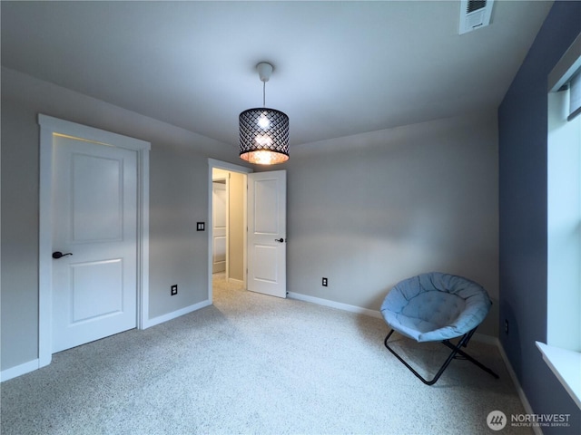 unfurnished room with visible vents, baseboards, and carpet floors