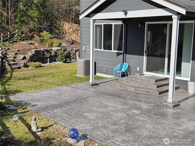 view of patio featuring cooling unit and fence