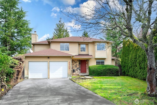 traditional home with a shingled roof, aphalt driveway, a front yard, a chimney, and a garage