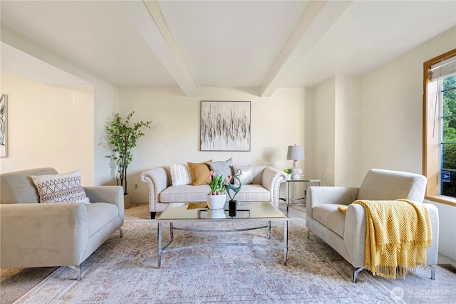 living room with beam ceiling