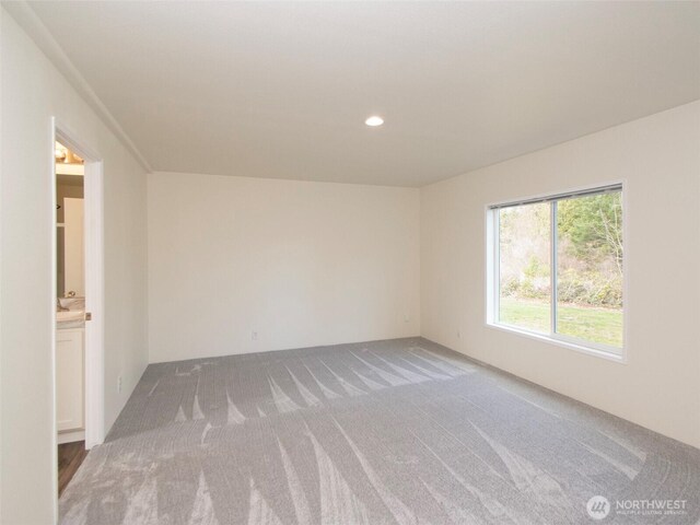 empty room featuring recessed lighting and carpet flooring