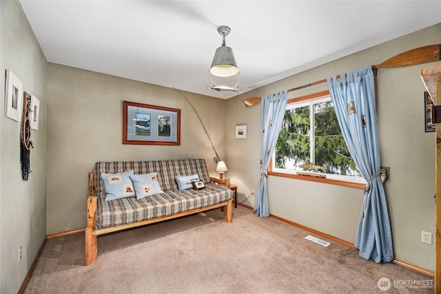 sitting room featuring visible vents, baseboards, and carpet