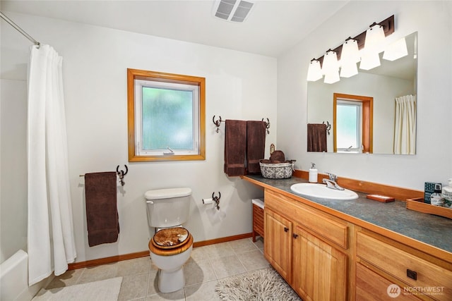 bathroom featuring visible vents, toilet, tile patterned flooring, baseboards, and vanity