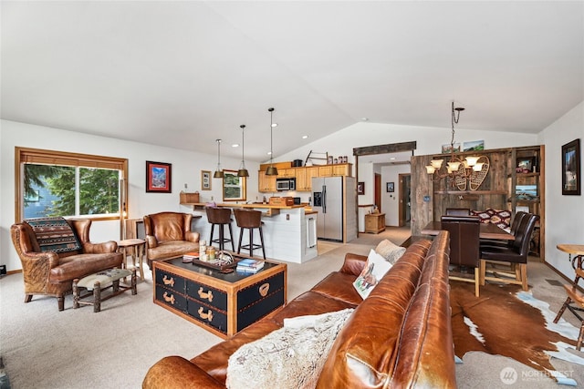 living area with a notable chandelier, lofted ceiling, and light colored carpet