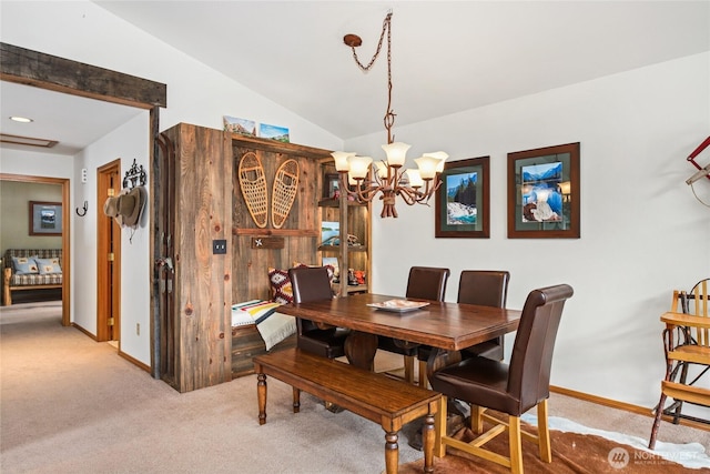 dining area featuring an inviting chandelier, vaulted ceiling, baseboards, and carpet floors