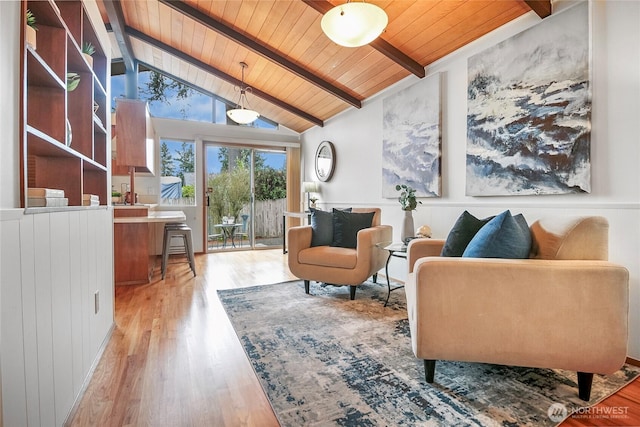 sitting room featuring wooden ceiling, vaulted ceiling with beams, and light wood-type flooring