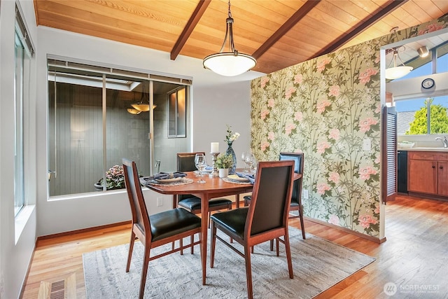 dining space featuring visible vents, wood ceiling, wood finished floors, and vaulted ceiling with beams