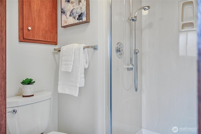 bathroom with a walk in shower and toilet