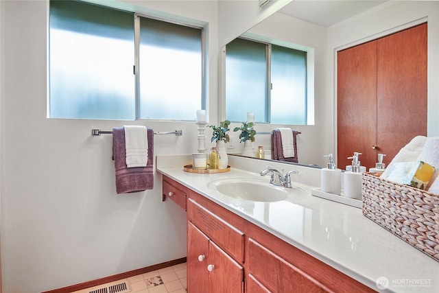 bathroom featuring baseboards and vanity