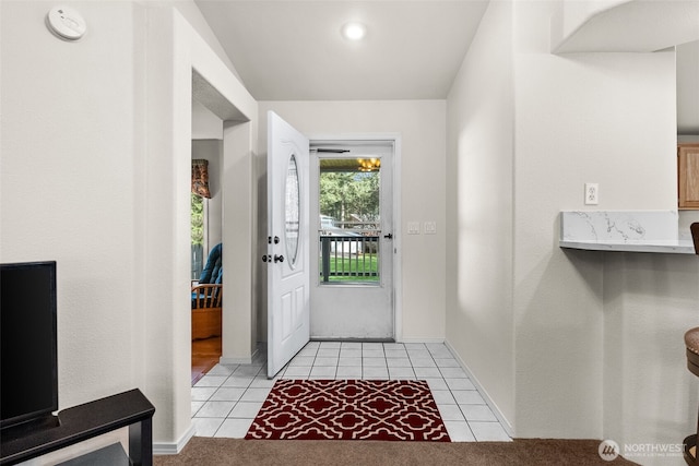 entrance foyer featuring light tile patterned floors and baseboards