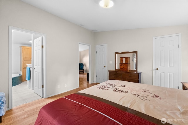 bedroom with wood finished floors