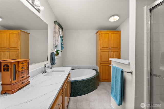 bathroom with a shower with door, tile patterned flooring, vanity, and a garden tub