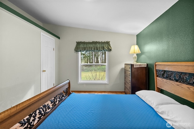 bedroom featuring baseboards