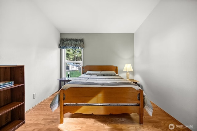 bedroom with wood finished floors