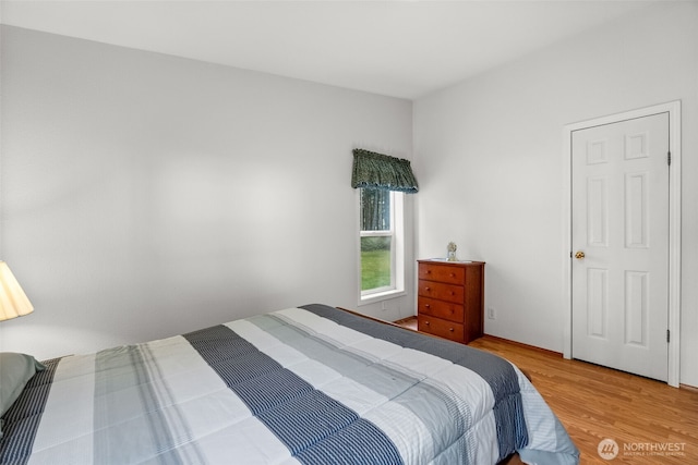 bedroom with wood finished floors