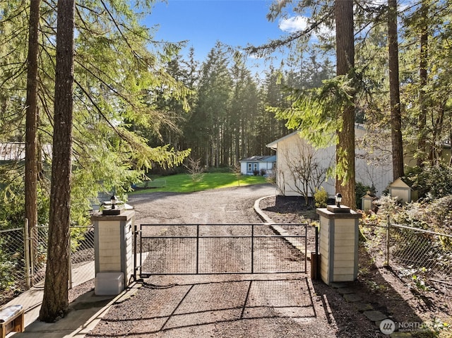 view of gate featuring a fenced front yard