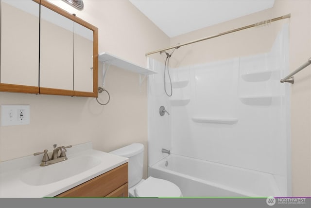 bathroom with toilet, vanity, and bathtub / shower combination