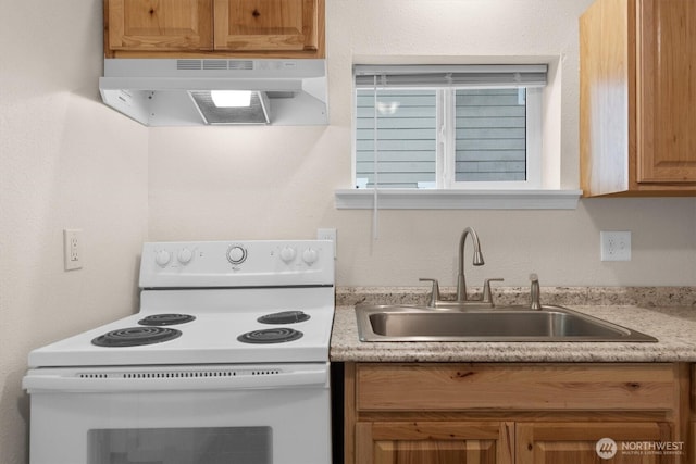 kitchen featuring a sink, light countertops, under cabinet range hood, and white range with electric stovetop