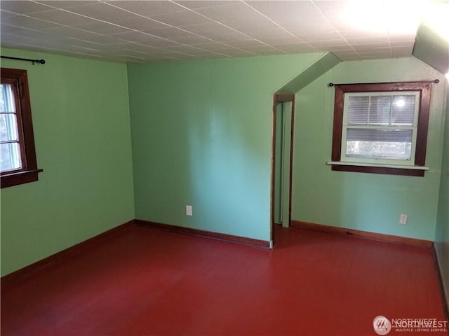 bonus room featuring baseboards