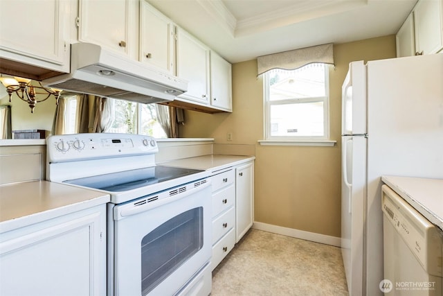 kitchen featuring under cabinet range hood, a tray ceiling, white appliances, and white cabinetry