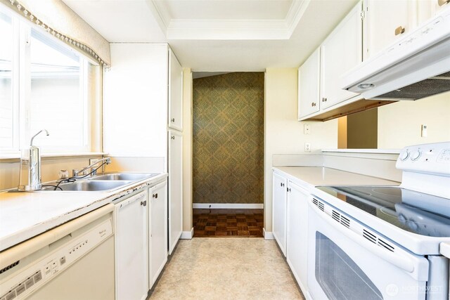 kitchen with wallpapered walls, a tray ceiling, ornamental molding, white appliances, and white cabinetry