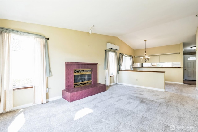 unfurnished living room featuring lofted ceiling, carpet, and a wall mounted AC