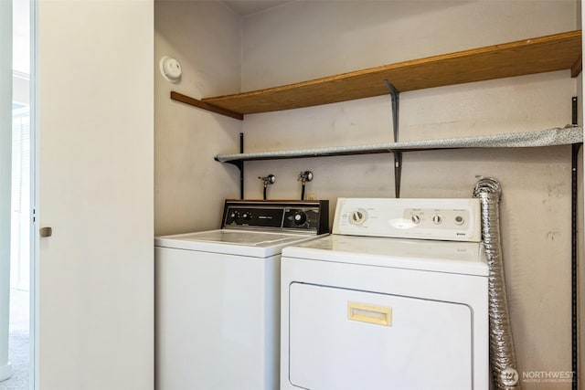 laundry area with washing machine and clothes dryer