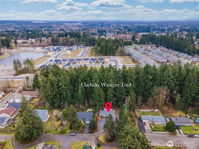 birds eye view of property featuring a water view