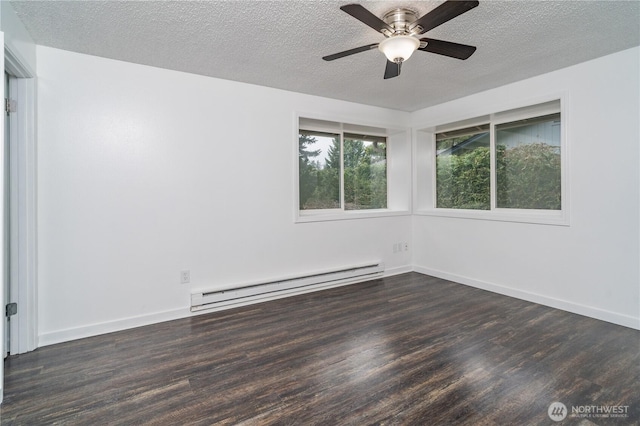 empty room with dark wood-style floors, a textured ceiling, baseboards, and a baseboard radiator