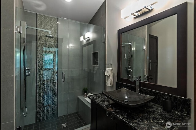 bathroom with vanity and a shower stall