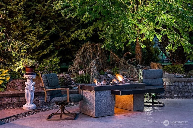 view of patio featuring a fire pit