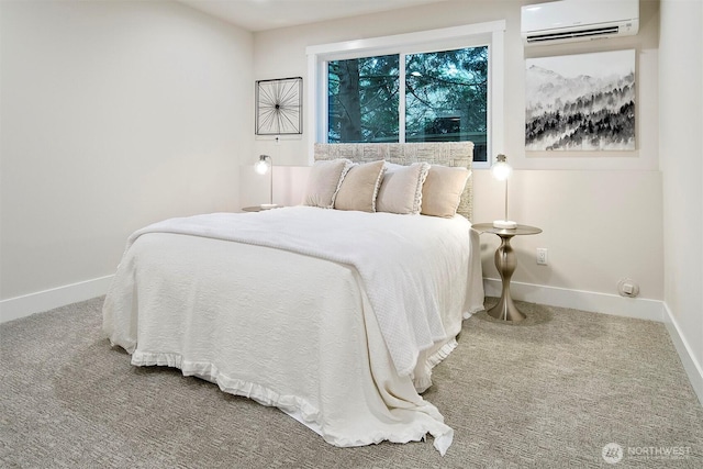 carpeted bedroom with baseboards and a wall mounted air conditioner