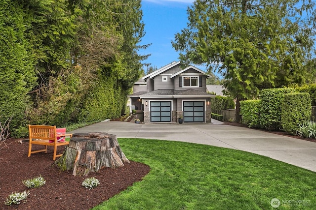 view of front of house featuring a shingled roof, a front lawn, concrete driveway, stone siding, and an attached garage