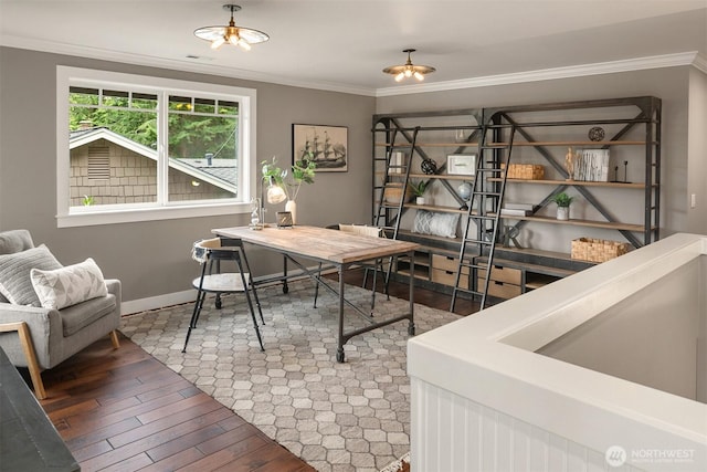 office space with visible vents, ornamental molding, baseboards, and wood finished floors