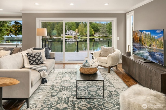 living room featuring recessed lighting, wood finished floors, and ornamental molding