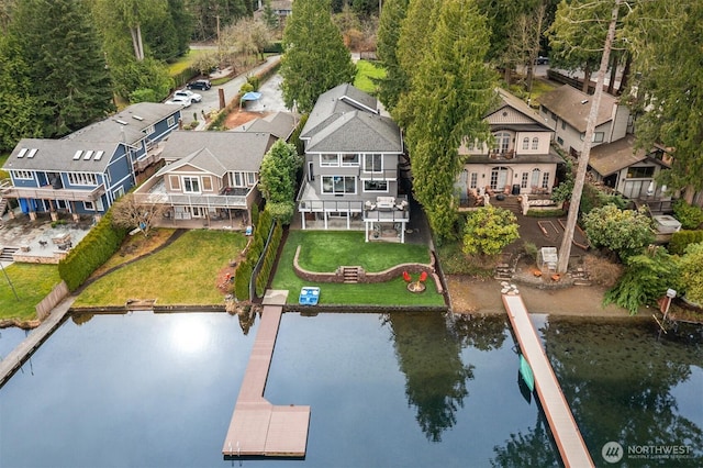 aerial view featuring a residential view and a water view