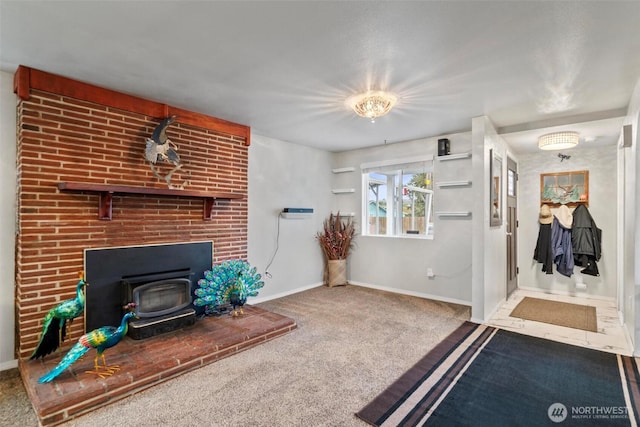 carpeted living area featuring a wood stove and baseboards