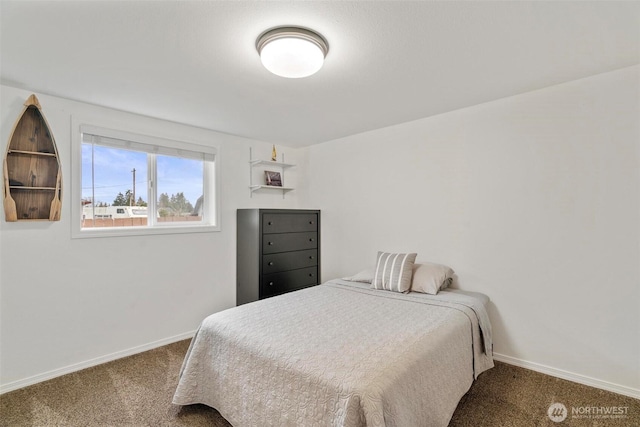 carpeted bedroom featuring baseboards