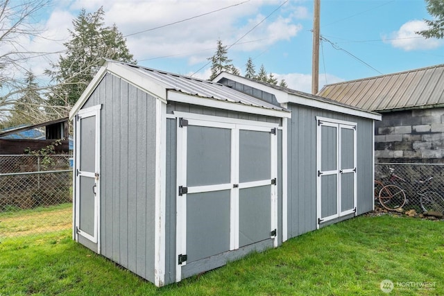 view of shed with fence