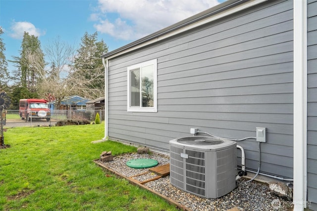 exterior space with central AC and fence