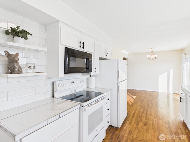 kitchen featuring light wood-type flooring, decorative backsplash, an inviting chandelier, white appliances, and white cabinetry