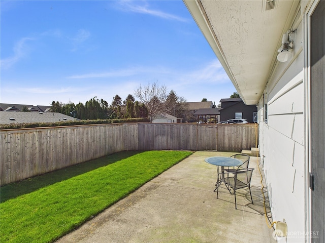 view of patio / terrace featuring a fenced backyard and visible vents