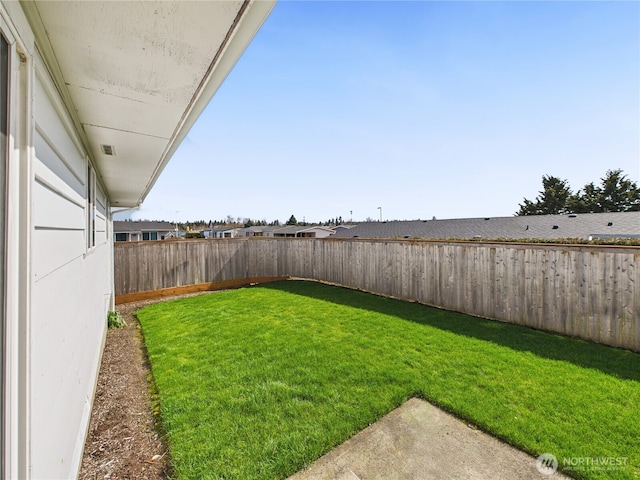 view of yard with a fenced backyard