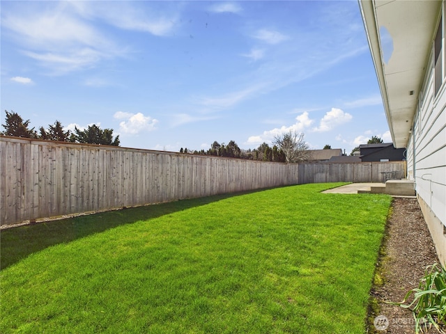 view of yard with a fenced backyard