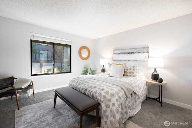 bedroom featuring carpet flooring, a textured ceiling, and baseboards